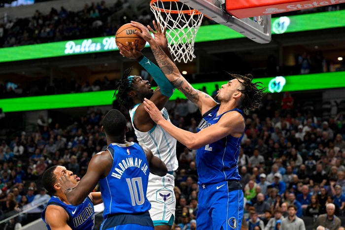 Dallas Mavericks rookie Dereck Lively II contests Charlotte Hornets' Mark Williams, who, like Lively, also played his college ball at Duke.